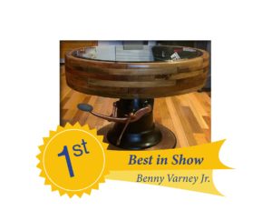 Benny Varney's winning entry. A flat wheel grist mill pulley and barbershop chair pedestal converted into a coffee table.