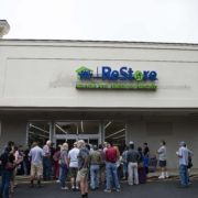 A crowd of people waiting outside of the Weaverville ReStore on opening day.