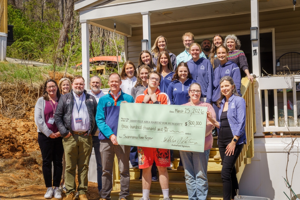Dsc4592 Asheville Christian Academy staff and students stand with ARCHR partners, Asheville Habitat staff, and local Swannanoa Homeowner and ARCHR client Kathleen as they present the donation.
